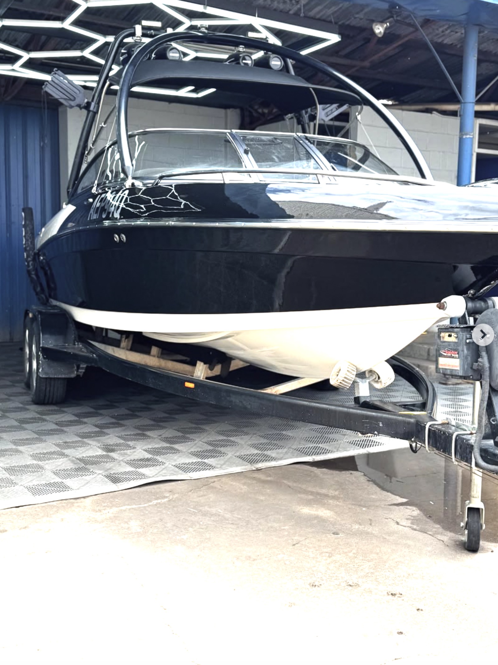 Black ski boat detailed at TB Detailing